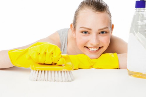 Technician treating a mattress stain in an East London flat